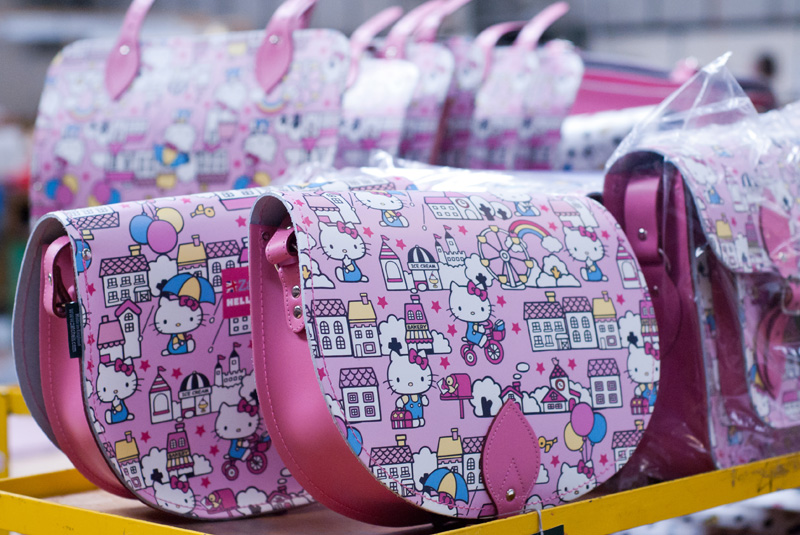 FAIIINT Zatchels factory shop opening Leicester, pink Hello Kitty satchel bags lined up in the factory