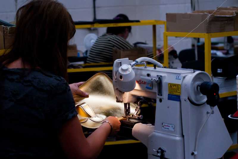 FAIIINT Zatchels factory shop opening Leicester, Leather sewing machinist stitching metallic gold satchel bag at the factory