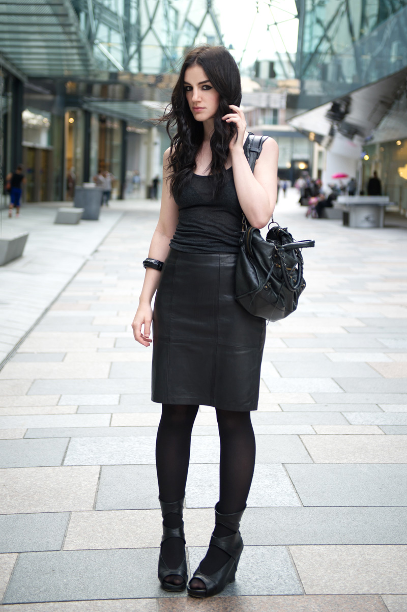 Fashion blogger Stephanie of FAIIINT wearing Reiss black leather Ezra skirt, Topshop charcoal grey tank top, Rick Owens wedges, ASOS studded bangle, Balenciaga city bag. All black outfit, dark style, texture mix, street style.