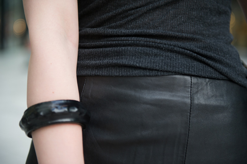 Fashion blogger Stephanie of FAIIINT wearing Reiss black leather Ezra skirt, Topshop charcoal grey tank top, Rick Owens wedges, ASOS studded bangle, Balenciaga city bag. All black outfit, dark style, texture mix, street style.