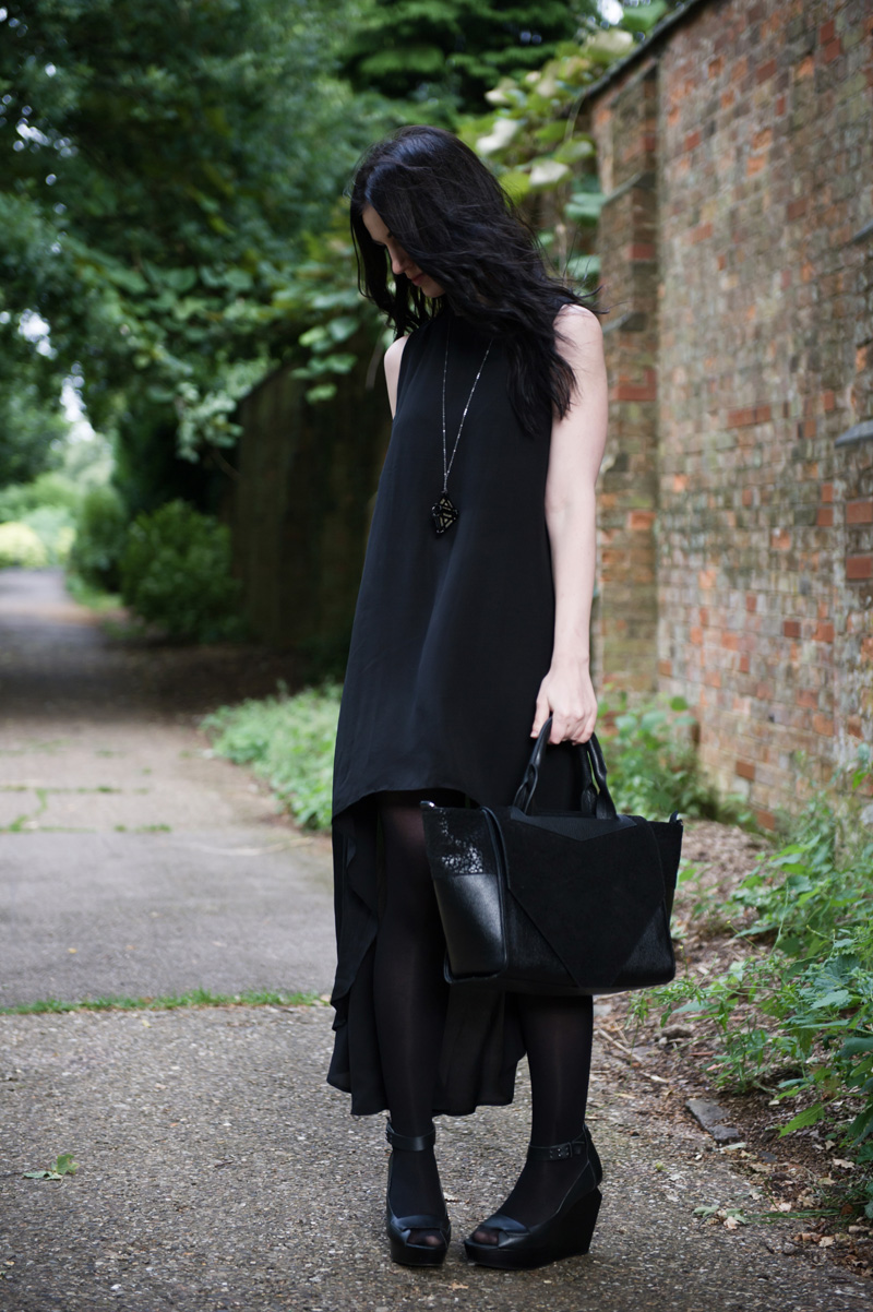 Fashion blogger Stephanie of FAIIINT wearing Glamorous dipped hem dress, Belle's Bejewelled diamond geometric necklace, skin by Finsk cut out wedges, Bracher Emden classic tote bag. All black outfit, street style, goth.