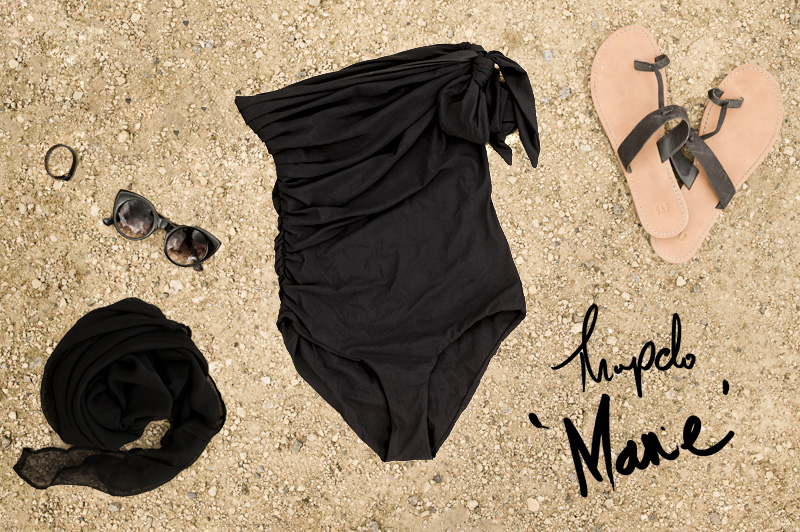 FAIIINT swimwear shopping round up, Thapelo draped rouched Marie asymmetric black bandeau swimsuit, with chiffon sarong, GAP Sandals, ASOS kitten eye sunglasses. All black swimwear styling.