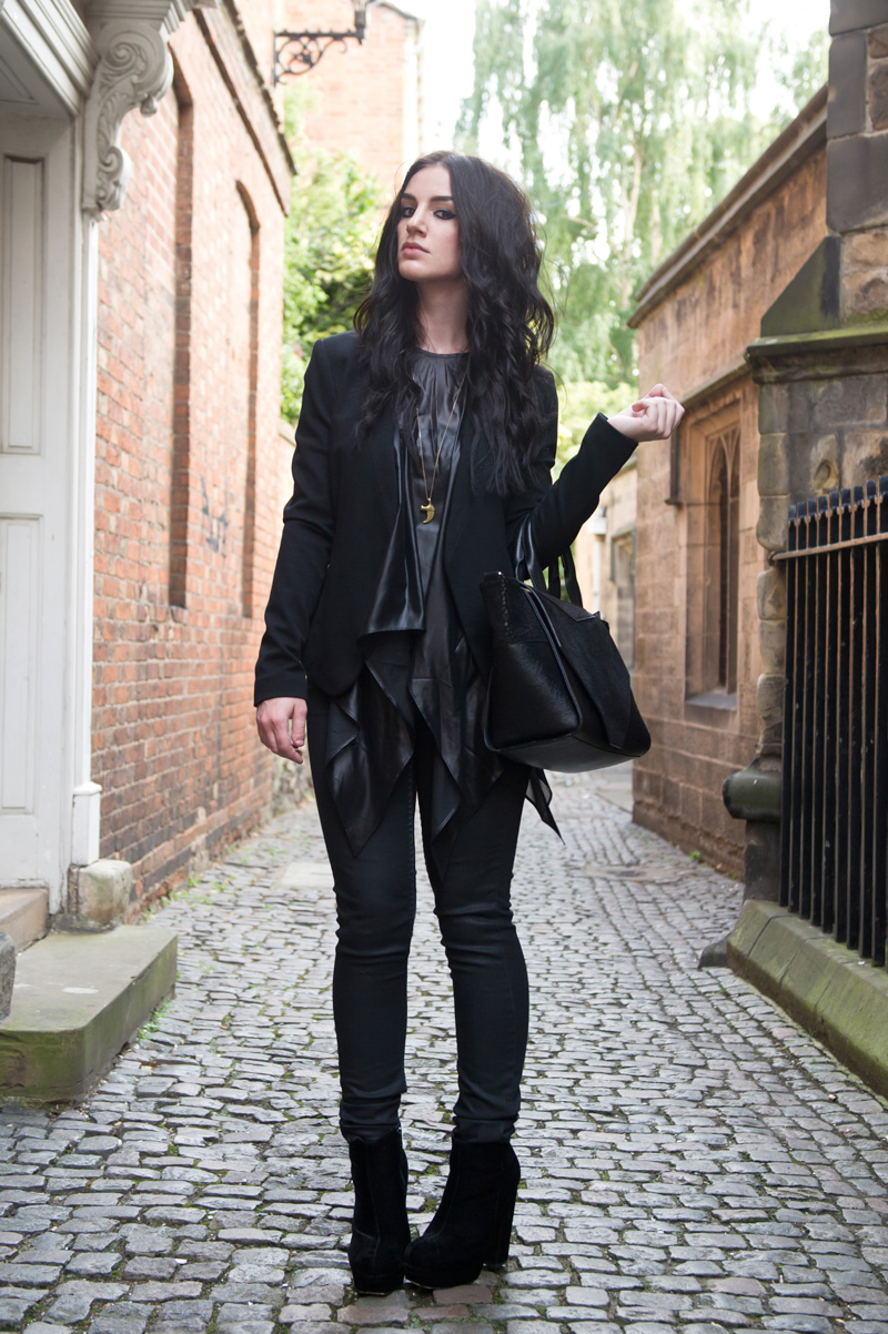 Fashion blogger Stephanie of FAIIINT wearing Topshop at Outfit collarless blazer, ASOS wet look draped asymmetric top, Topshop coated jeans, Stylistpick velvet boots, Bracher Emden classic tote bag. All black everything, street style, outfit of the day