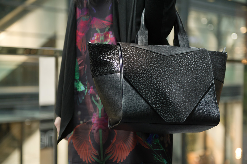Fashion blogger Stephanie of FAIIINT wearing Barneys Originals drape leather jacket, Yumi midnight menagerie bird & floral print dress, Bracher Emden classic tote bag, Skin by Finsk lace up wedges, Catarzi fedora, all black outfit, gothic, street style.