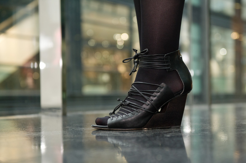 Fashion blogger Stephanie of FAIIINT wearing Skin by Finsk black lace up cut out wedge sandals