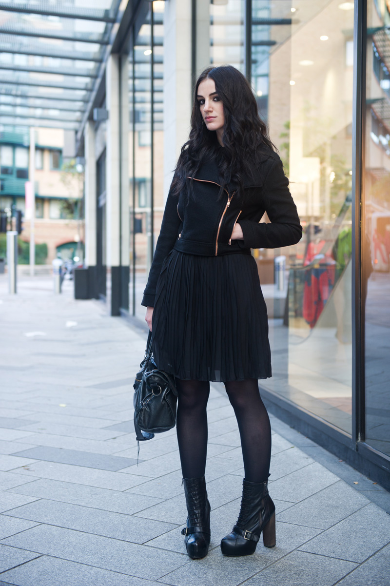 Fashion blogger Stephanie of FAIIINT wearing minkpink wool biker jacket, Pussycat London pleated shirt dress, Topshop lace up boots, Balenciaga city bag. All black outfit, street style.