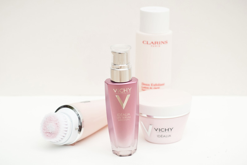 FAIIINT Skincare for acne prone oily skin. Vichy Idealia Life Serum & Smoothing & illuminating day cream, Philips Visapure facial cleansing brush, Clarins exfoliator brightening toner.