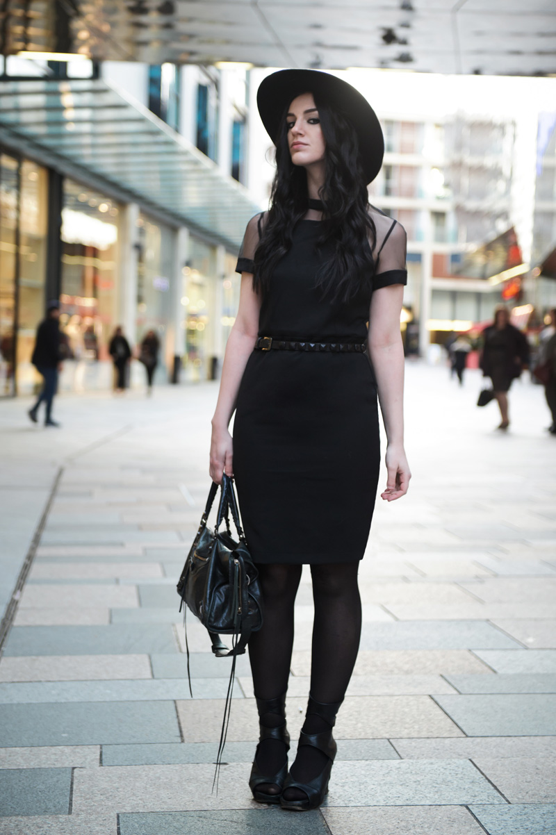 Fashion blogger Stephanie of FAIIINT wearing Catarzi fedora, Paper Dolls mesh panel dress, Topshop studded belt, Rick Owens wedges, Balenciaga city bag. All black outfit, gothic street style.