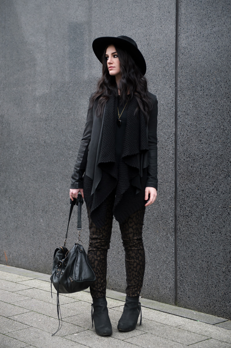 fashion blogger Stephanie of FAIIINT wearing Catarzi fedora, Barneys Originals leather draped jacket, ASOS chunky waterfall cardigan, Meltin Pot B-Side Emma reversible leopard jeans, Kurt Geiger wedge boots, Balenciaga city