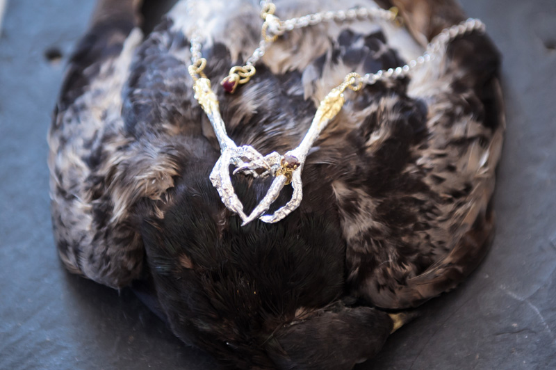 London fashion weekend designer shopping, Somerset House. Dead pigeon taxidermy, Tessa Metcalfe silver & gold bird claw necklace