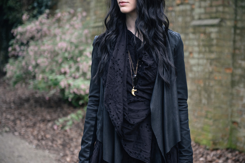 Fashion blogger Stephanie of FAIIINT wearing Allsaints draped embroidery anglaise dress, Barneys Originals leather jacket, Kurt Geiger buckled wedges, Balenciaga city bag, claw & obsidian arrowhead necklaces. All black outfit street style.