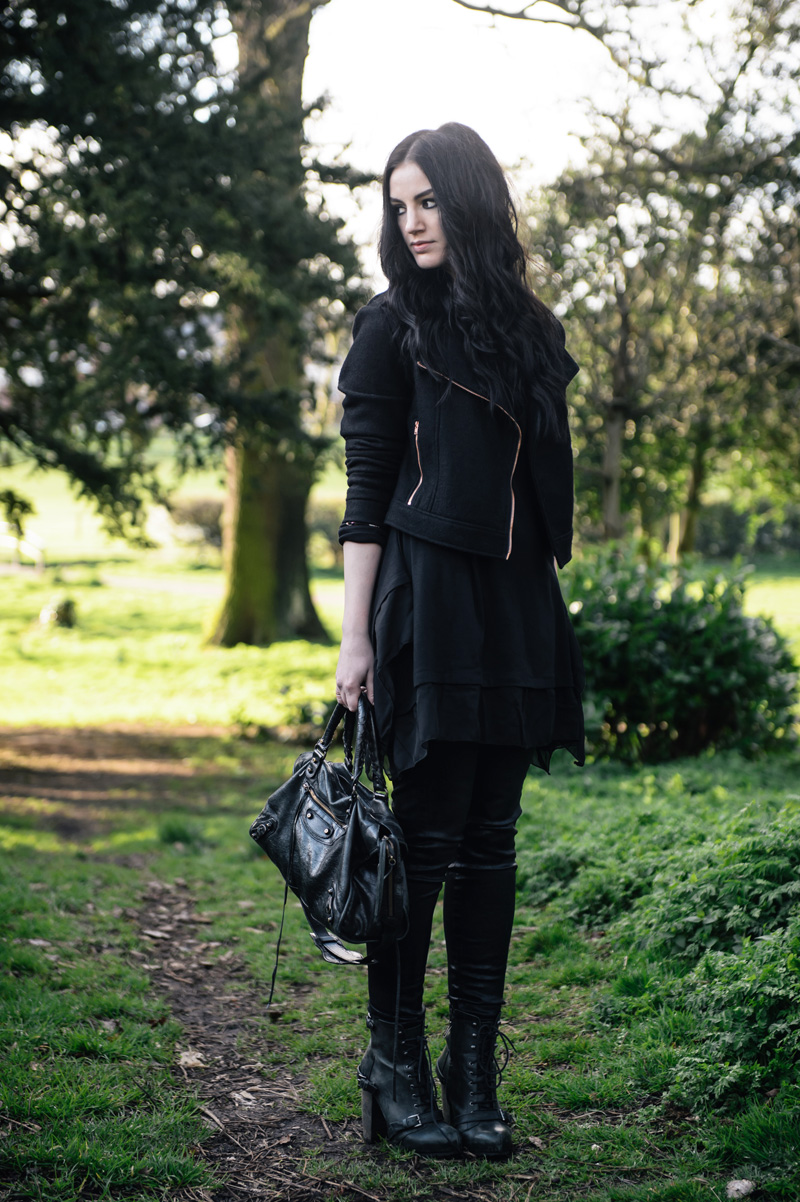 Fashion Blogger Stephanie of FAIIINT wearing all black outfit MinkPink wool biker jacket, Sammy Dress Tunic, Topshop Unique coated jeans, Topshop Boutique lace up boots, Balenciaga City bag, Next rose gold rings.