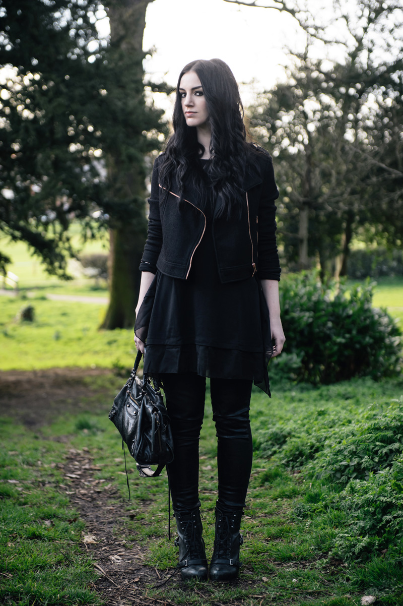 Fashion Blogger Stephanie of FAIIINT wearing all black outfit MinkPink wool biker jacket, Sammy Dress Tunic, Topshop Unique coated jeans, Topshop Boutique lace up boots, Balenciaga City bag, Next rose gold rings.