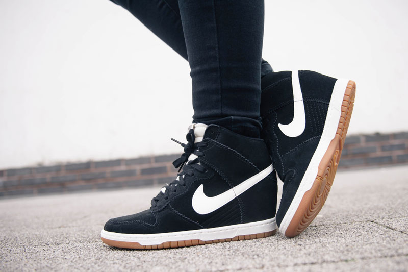 Fashion blogger Stephanie of FAIIINT wearing Nike sky hi high dunk sneakers black suede & white leather