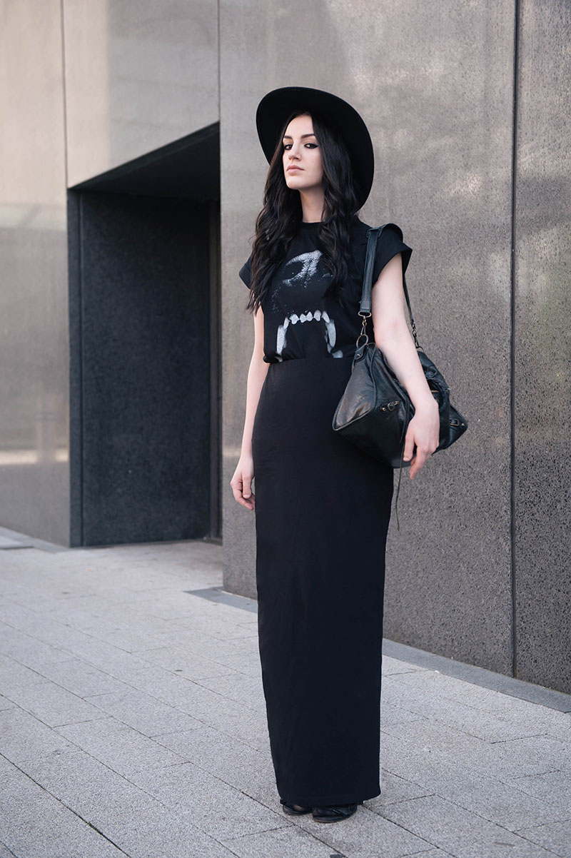 Fashion blogger Stephanie of FAIIINT wearing Catarzi black huge fedora, OASAP graphic black & white dog mouth teeth tee shirt, ASOS slim maxi skirt, Balenciaga city bag, Kurt Geiger wedges. Goth street style all black everything.