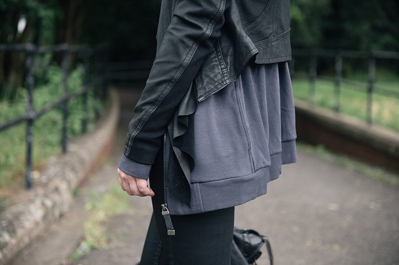 Fashion blogger Stephanie of FAIIINT wearing Barneys originals draped leather jacket, OnePiece charcoal stroll hoodie, Helmut Lang tee, Topshop coated jeans.