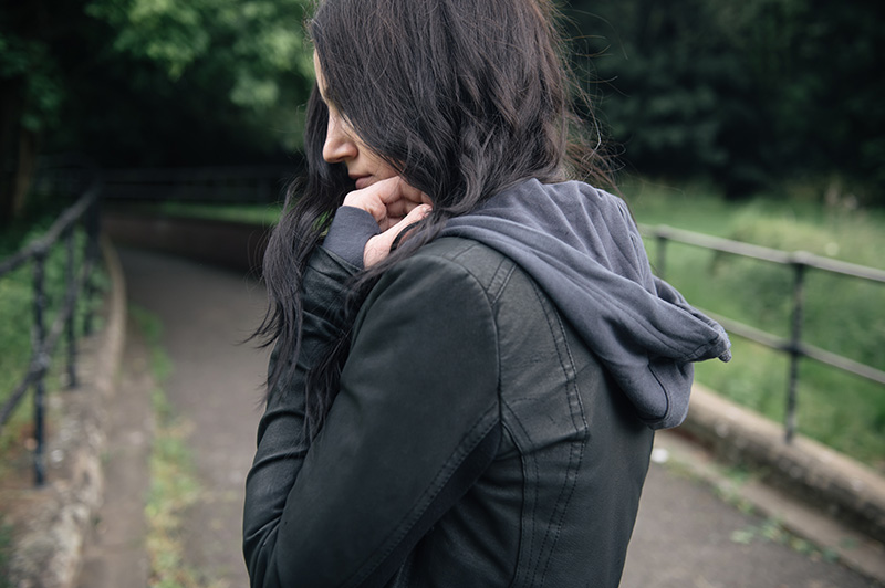 Fashion blogger Stephanie of FAIIINT wearing Barneys originals draped leather jacket, OnePiece charcoal stroll hoodie. All black off duty casual street style outfit.