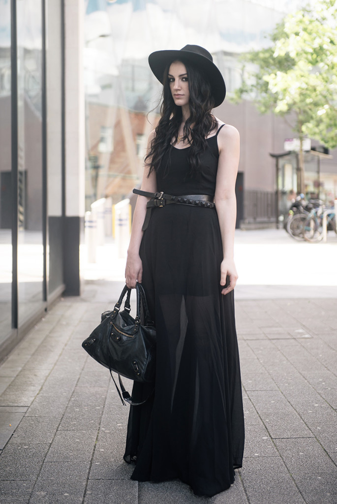 Fashion blogger Stephanie of FAIIINT wearing Choies black chiffon maxi dress, Catarzi Fedora, ASOS & Topshop studded wrap belt, RockLove sacred geometry gold chevron necklace, Kurt Geiger boots, Balenciaga city. All black summer goth street style outfit.