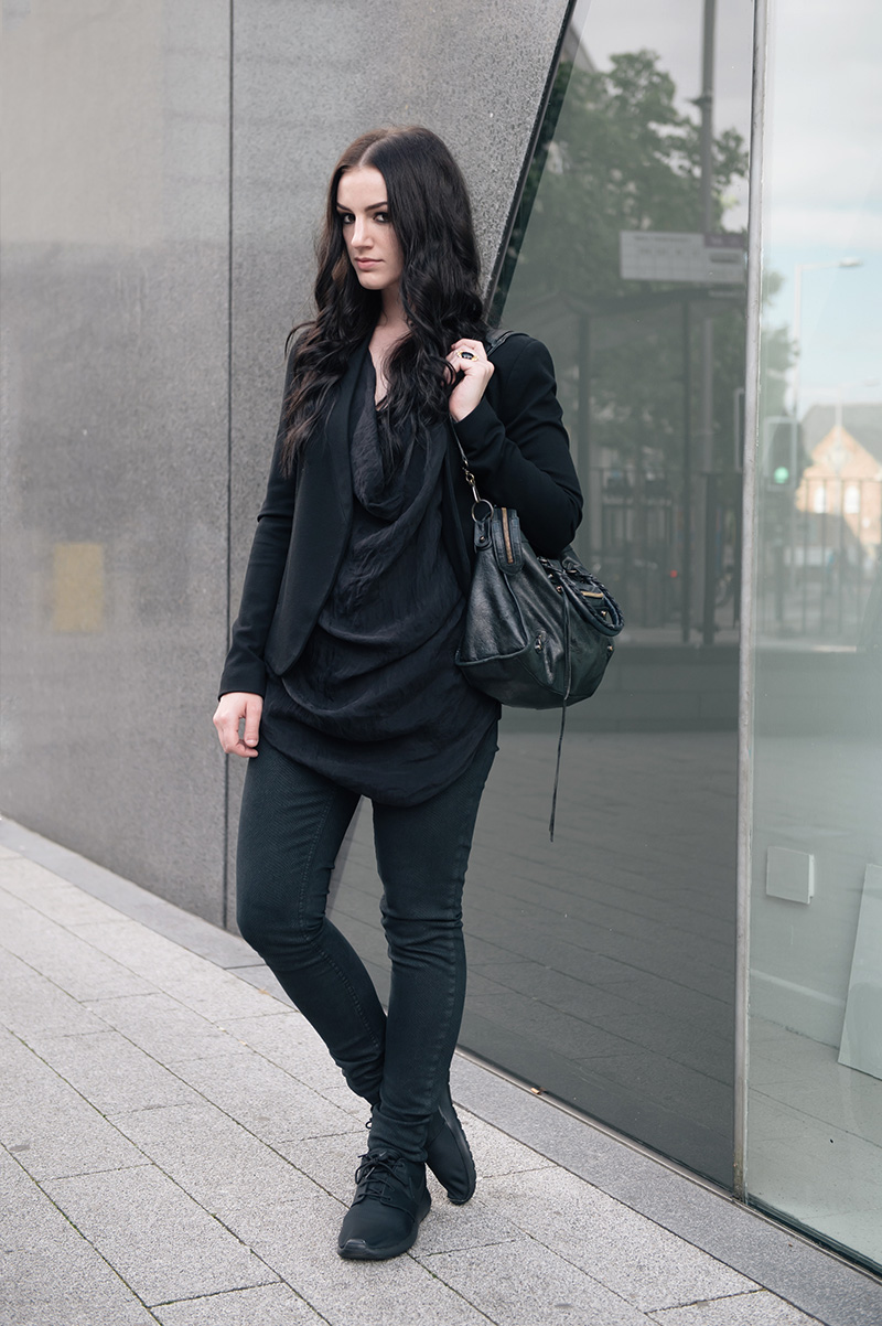 Fashion blogger Stephanie of FAIIINT wearing Topshop slim blazer & snake print skinny jeans, FOX draped silk cowl tank top, Kasun London vampire bite ring, Nike Roche Run monochrome black trainers, Balenciaga city. All black smart casual street style outfit.