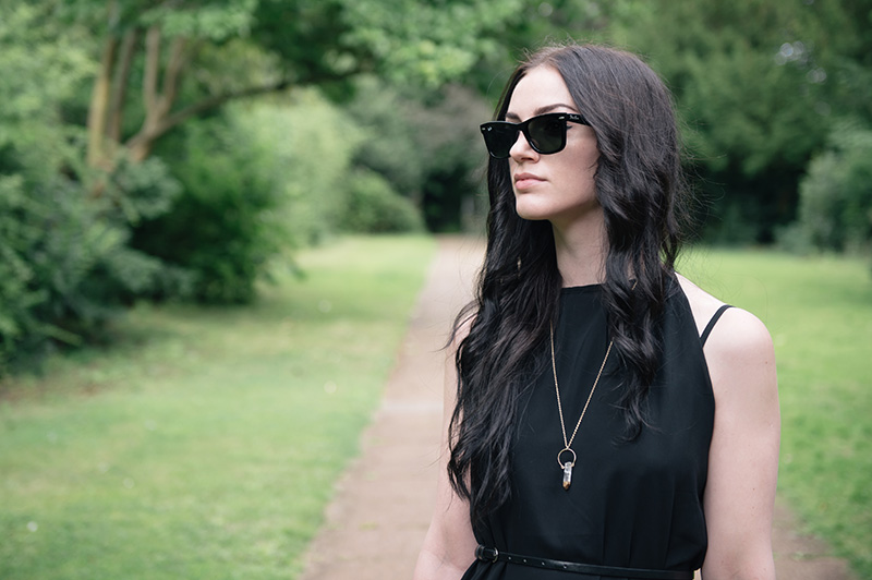 Fashion blogger Stephanie of FAIIINT wearing Abaday chiffon dress, Ray Ban Wayfarer sunglasses, Younghearts quartz crystal necklace. All black, dark fashion gothic summer street style outfit