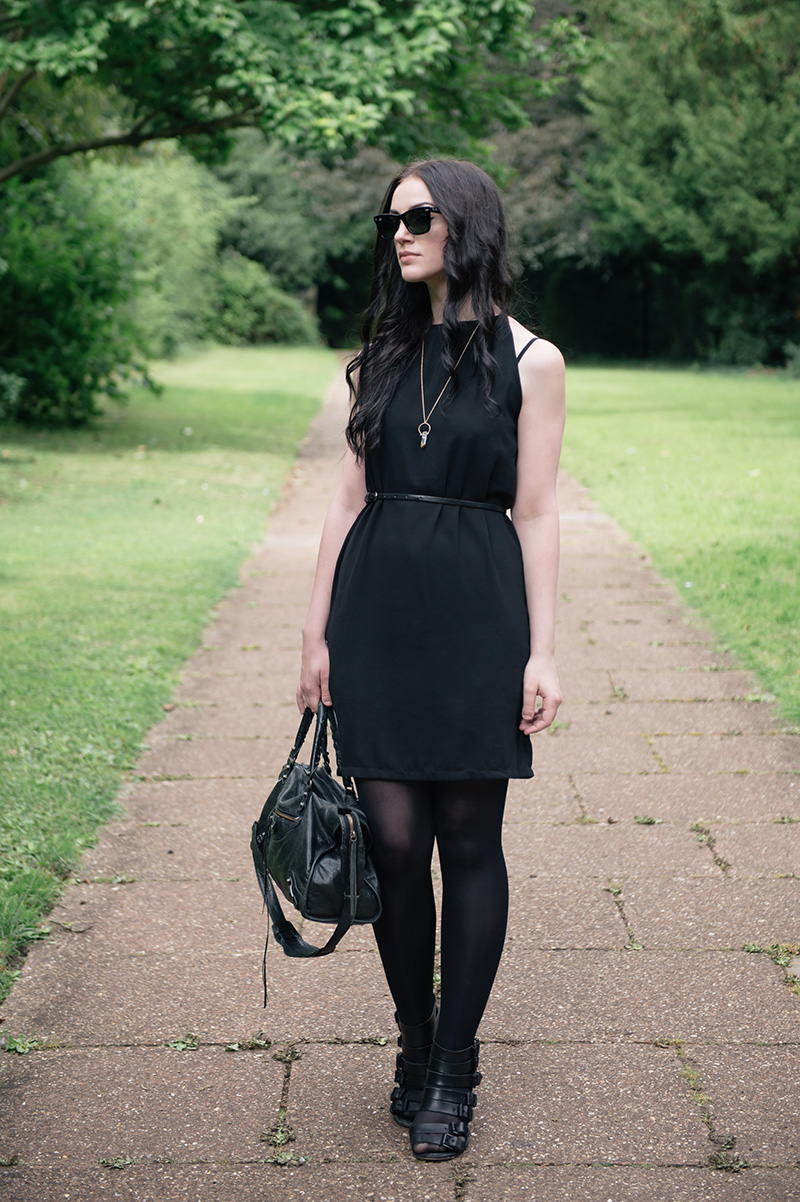 Fashion blogger Stephanie of FAIIINT wearing Abaday chiffon dress, Ray Ban Wayfarer sunglasses, Younghearts quartz crystal necklace, Kurt Geiger buckled wedges, Balenciaga city bag. All black, dark fashion gothic summer street style outfit