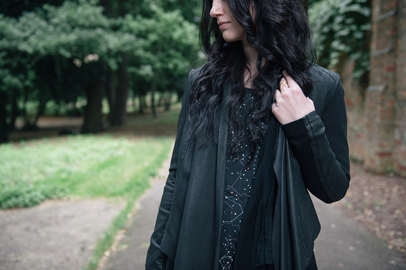 Fashion blogger Stephanie of FAIIINT wearing Barneys Originals draped leather jacket, ASOS cardigan, Yumi constellation print dress, RockLove gold arrow ring.