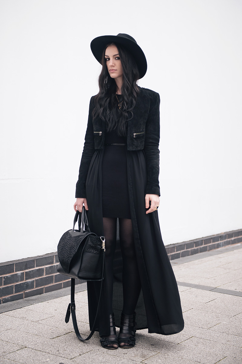 Fashion blogger Stephanie of FAIIINT wearing Catarzi fedora, Topshop laser cut cropped suede jacket, ASOS dress, BooHoo maxi chiffon kimono, Rocklove sacred geometry arrow ring & gold chevron necklace, Kasun London vampire bite ring, Kurt Geiger buckled wedges. All black goth witch street style outfit.