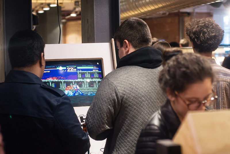 Urban Outfitters Leicester Store Launch guys playing arcade video games street fighter