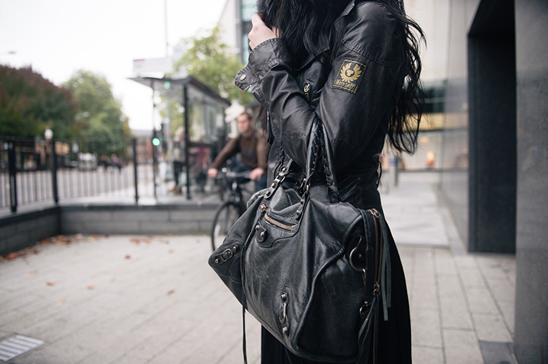 Fashion blogger Stephanie of FAIIINT wearing Balenciaga city bag, Belstaff Sammy Miller waxed jacket. All black street style outfit details.