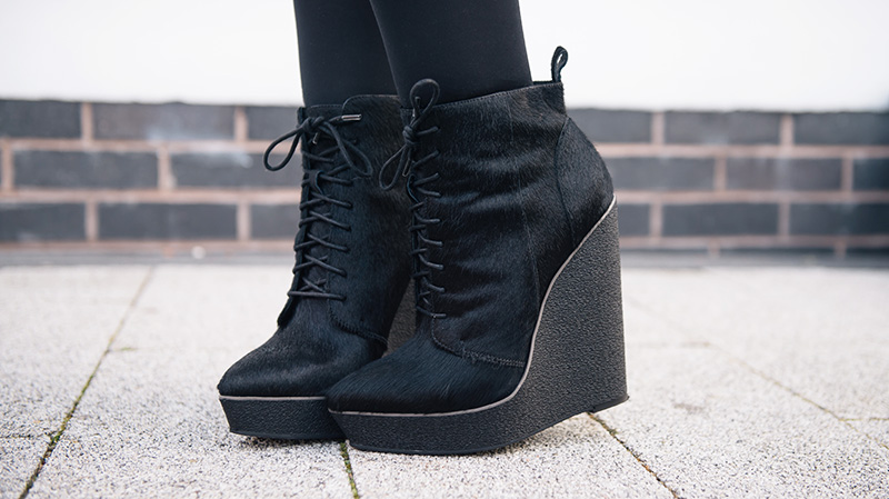 Fashion blogger Stephanie Brown of FAIIINT wearing Kurt Geiger ponyhair 'Solar' platform wedge ankle boots
