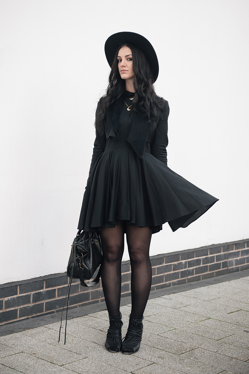 Fashion blogger Stephanie of FAIIINT wearing Todd Lynn x Topshop cropped tux jacket, H&M shirt dress, Phoebe Jewellery moonstone moon & little bat gold necklace, Skin by Finsk laced wedges, Balenciaga city bag, Catarzi fedora. All black witchy street style outfit.