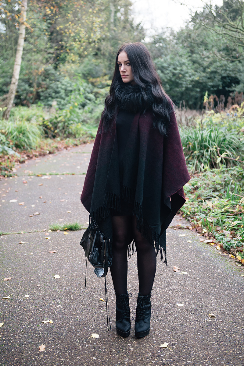 Fashion blogger Stephanie of FAIIINT wearing Yumi black & oxblood ombre blanket cape poncho, Phoebe Jewellery double moonstone moon & star and star stacking rings, FAIIINT faux fur snood, Kurt Geiger ponyhair ankle boots, Balenciaga city. Cosy Autumn street style outfit.