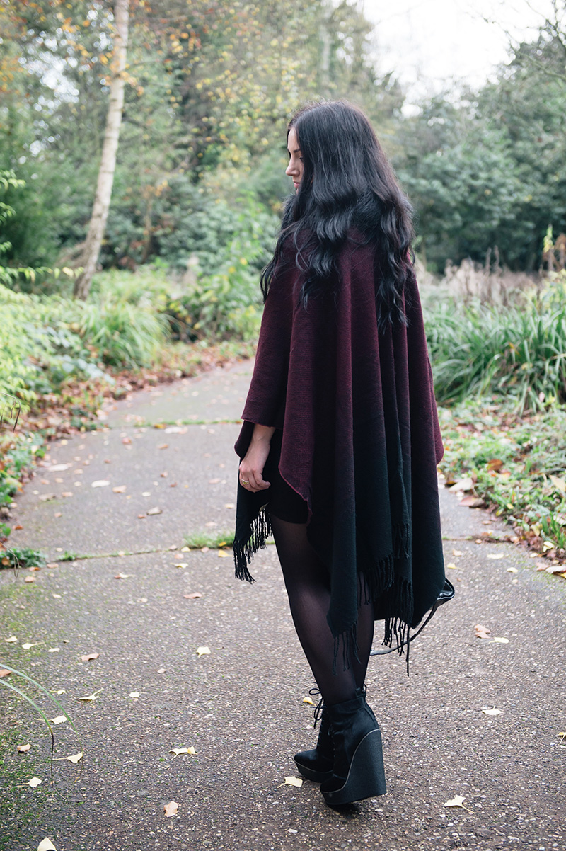 Fashion blogger Stephanie of FAIIINT wearing Yumi black & oxblood ombre blanket cape poncho, Phoebe Jewellery double moonstone moon & star and star stacking rings, FAIIINT faux fur snood, Kurt Geiger ponyhair ankle boots, Balenciaga city. Cosy Autumn street style outfit.