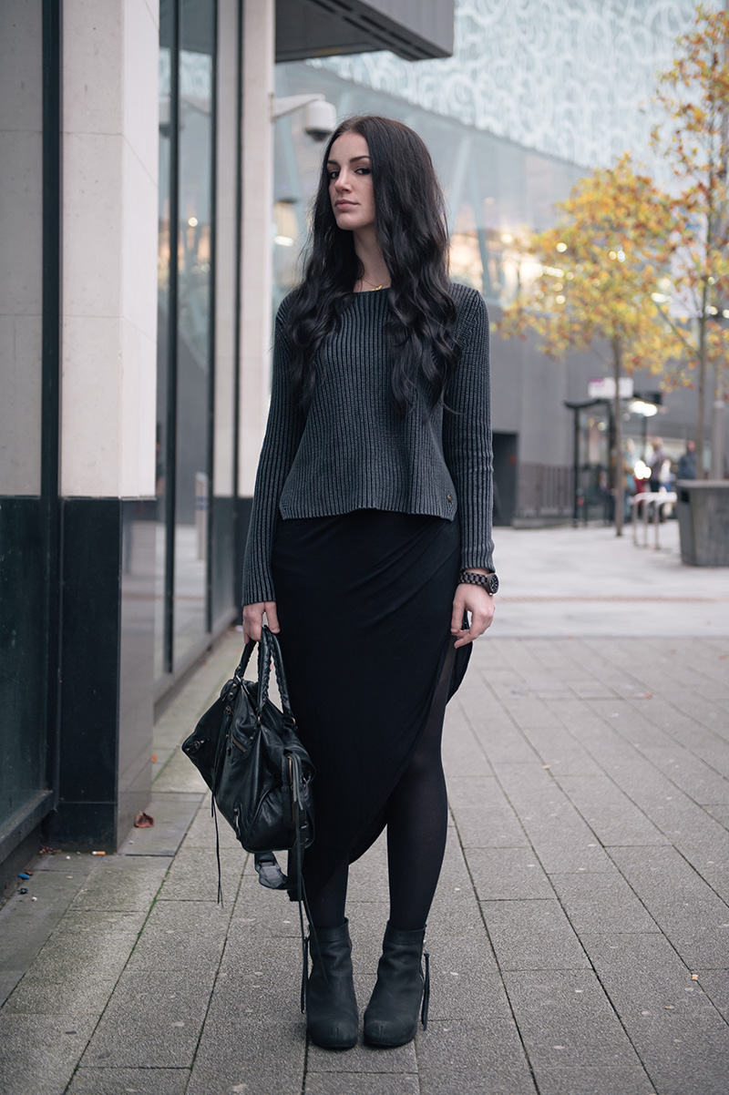 Fashion blogger Stephanie of FAIIINT wearing Yumi ribbed knit grey jumper, River Island asymmetric skirt, Phoebe Jewellery little gold bat necklace, Jord wooden watch, Kurt Geiger wedge boots, Balenciaga city.