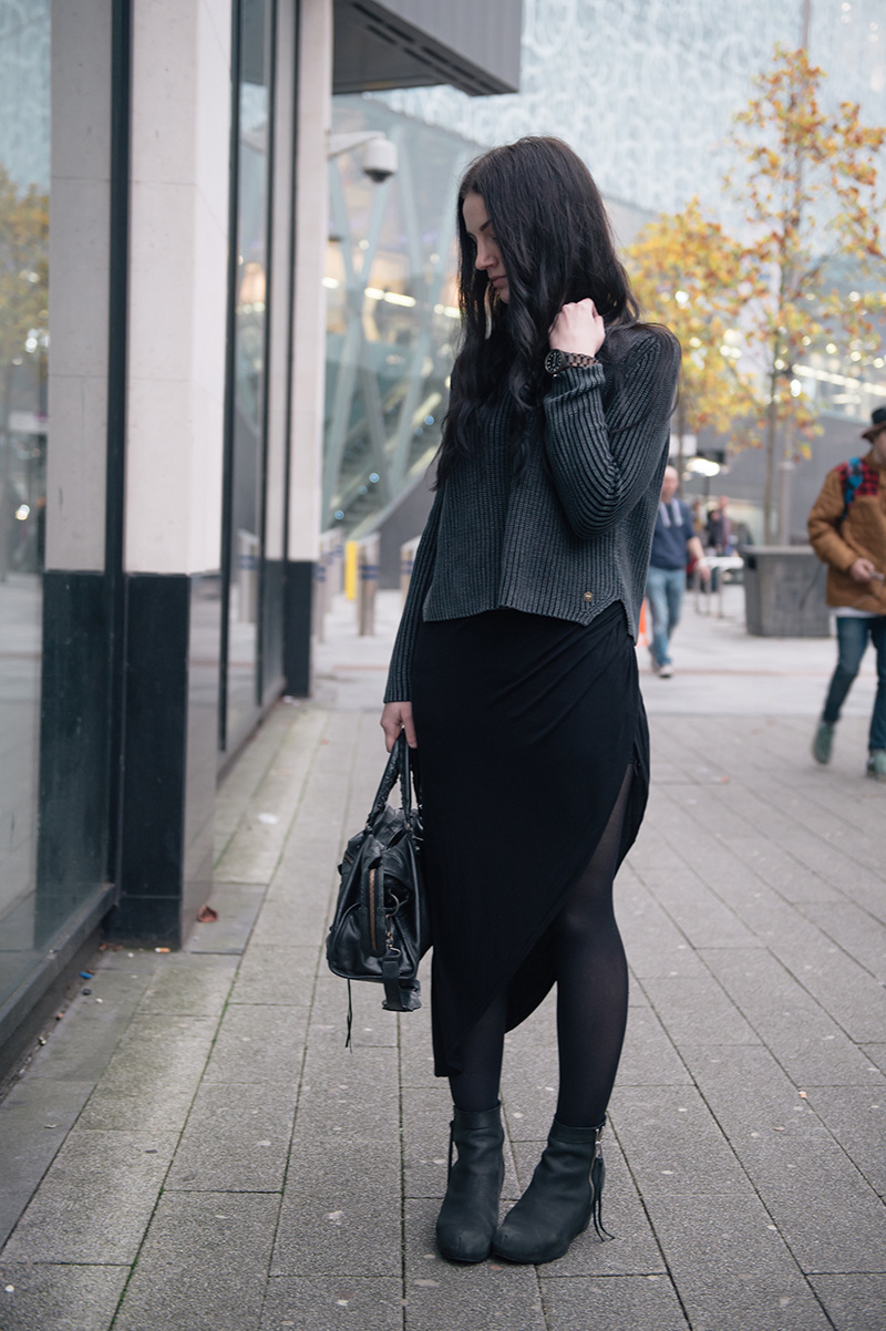Fashion blogger Stephanie of FAIIINT wearing Yumi ribbed knit grey jumper, River Island asymmetric skirt, Phoebe Jewellery little gold bat necklace, Jord wooden watch, Kurt Geiger wedge boots, Balenciaga city.