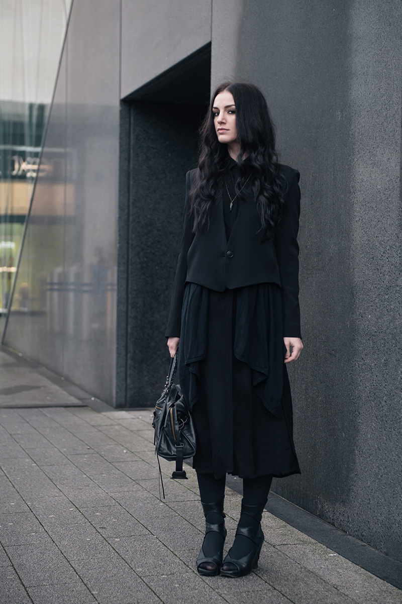 Fashion blogger Stephanie of FAIIINT wearing Theyskens' Theory Cropped Jacket, Mango draped cardigan, Isabel De Pedro printed shirt dress, BVRNT wooden necklace, Rick Owens Wedges, Balenciaga city bag. All black everything street style.