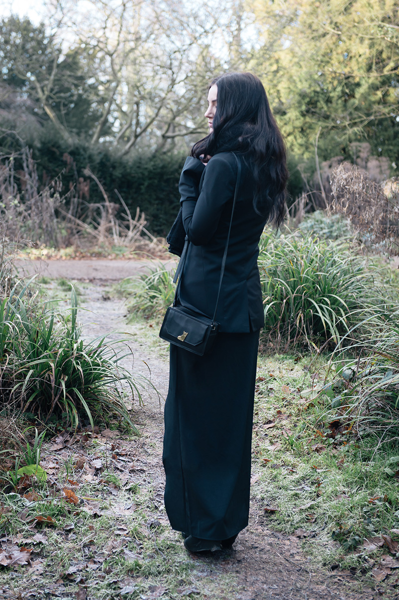 Fashion blogger Stephanie of FAIIINT wearing ASOS oversized scarf, Todd Lynn x Topshop Tux Jacket, State of Being cross over maxi skirt, Nica Venice small crossbody bag, Phoebe Jewellery moonstone moon & star double ring, Rick Owens wedge sandals. All black street style gothic draped outfit.