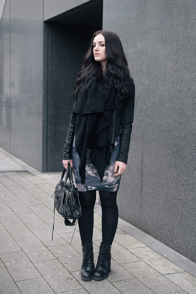 Fashion blogger Stephanie of FAIIINT wearing ASOS scarf, Barneys Original's draped leather jacket, Daisy Street oil spill printed dress, Ash Poker lace up boots, Balenciaga city bag. All black gothic casual street style outfit.