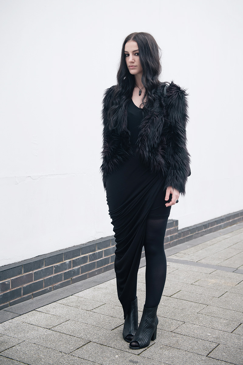 Fashion blogger Stephanie of FAIIINT wearing H&M faux fur shaggy jacket, Helmut Lang tee, FAIIINT clothing swathe draped skirt, Elemental Luxury Quartz Neclace & Ring, Ash Fancy BIS laser cut out leather boots, Mulberry Mabel bag. All black gothic winter street style outfit.