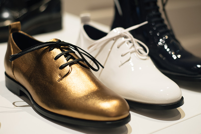 PLFM London footwear show press day Autumn Winter 2015. Jil Sander Navy metallic gold brogues flat shoes, white & black patent ankle boots.