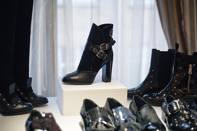 PLFM London footwear show press day Autumn Winter 2015. Havva black ankle boots in leather & ponyhair with wrap over buckles & studs.
