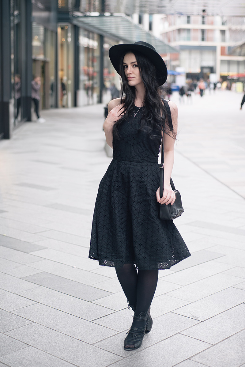 Fashion blogger Stephanie of FAIIINT wearing Catarzi fedora hat, Bloody Mary Metal tiny tooth silver necklace, Uttam Boutique broderie anglaise dress, Betty Jackson zipped bag, Skin by Finsk lace up wedges. All black gothic street style spring summer outfit.