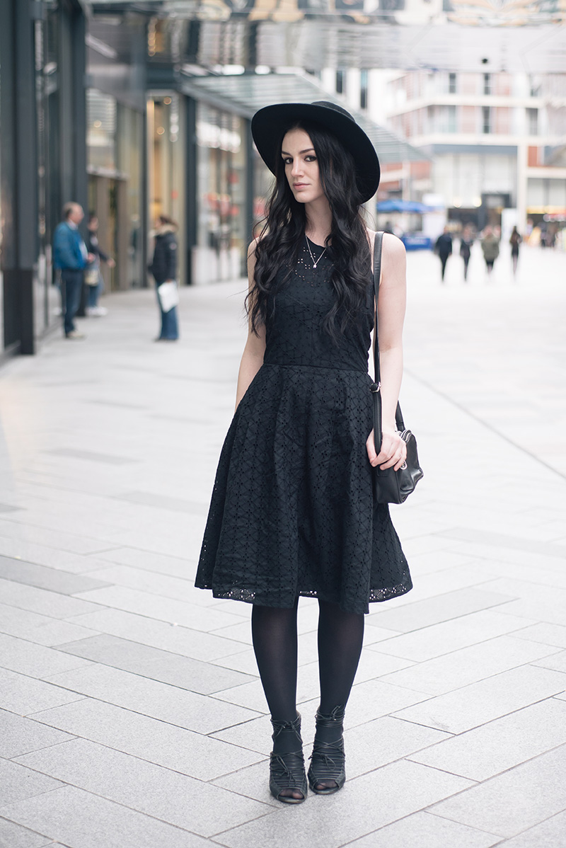 Fashion blogger Stephanie of FAIIINT wearing Catarzi fedora hat, Bloody Mary Metal tiny tooth silver necklace, Uttam Boutique broderie anglaise dress, Betty Jackson zipped bag, Skin by Finsk lace up wedges. All black gothic street style spring summer outfit.