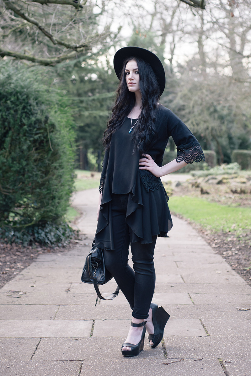 Fashion blogger Stephanie of FAIIINT wearing Dorothy Perkins style heroes soft throw on & girlfriend jean, lace trimmed cropped kimono, washe black skinny jeans, Catarzi fedora, Love drape side tee top, Sightstone aqua aura quartz necklace, Skin by Finsk wedges, Balenciaga city bag. All black street style gothic spring outfit.