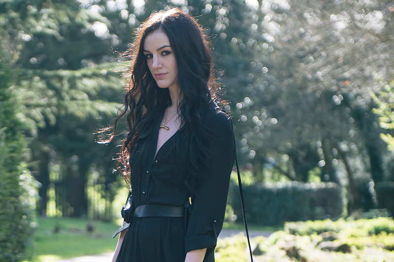 Stephanie of FAIIINT wearing F&F utility black chiffon jumpsuit, H&M knotted belt, Sara Gunn horizontal gold bone necklace. Portrait details.