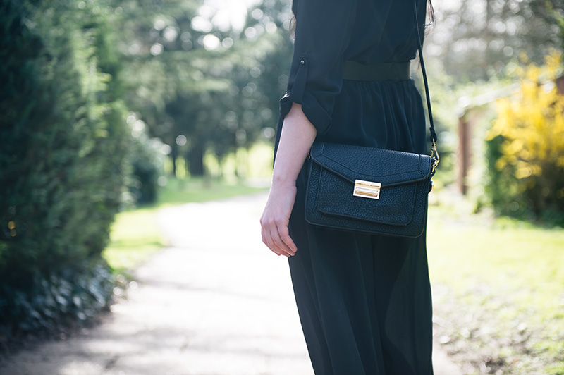 Stephanie of FAIIINT wearing F&F utility black chiffon jumpsuit, Marc B black Jude satchel bag. Outfit details.