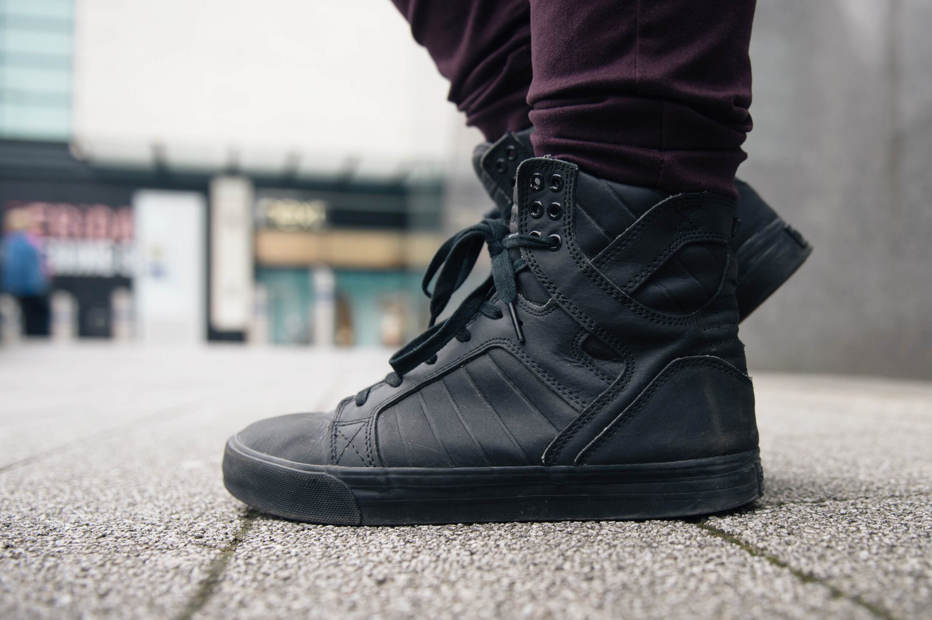 Fashion blogger Stephanie of FAIIINT wearing Supra Skytop black satin tuf red carpet series sneakers