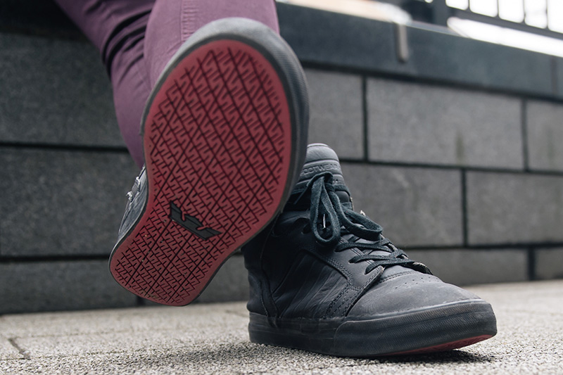 Fashion blogger Stephanie of FAIIINT wearing Supra Skytop black satin tuf red carpet series sneakers all black with red sole