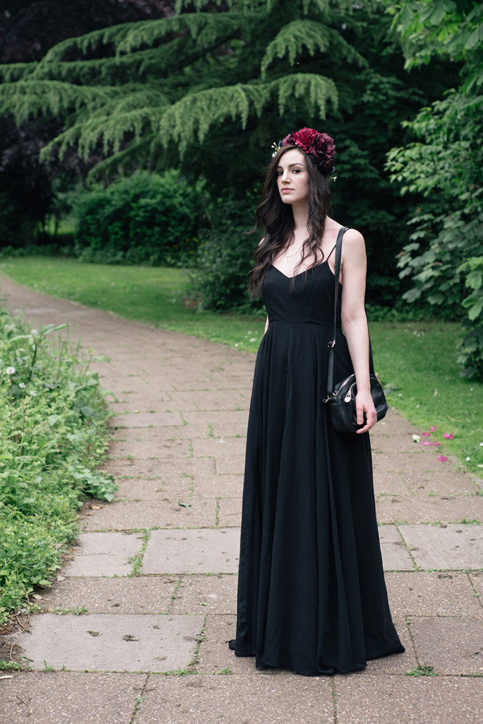 Fashion blogger Stephanie of FAIIINT wearing Gypsy Rose Vintage plum & pink flower crown, Religion Olsen Maxi dress. All black gothic summer wedding guest outfit. Dark style.