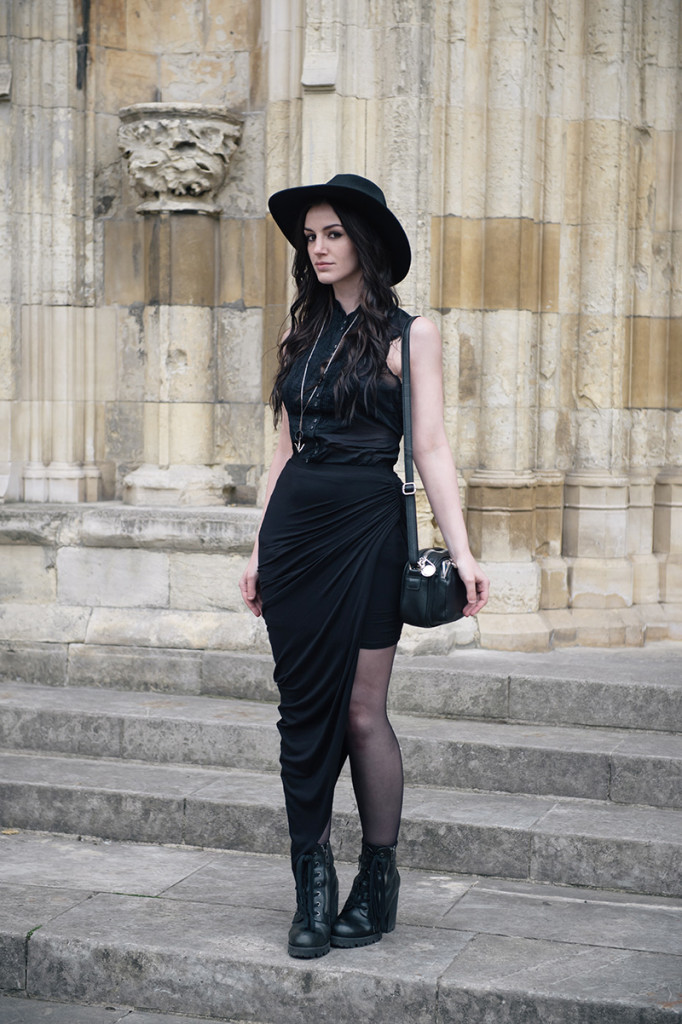 Fashion blogger Stephanie of FAIIINT wearing Catarzi wide brim fedora, Allsaints shirt, FAIIINT draped jersey asymmetric skirt, Ash Poker lace up boots, Hvnter Gvtherer Lacustrine necklace & rings. All black everything dark style goth outfit.